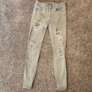 Olive green American Eagle skinny jeans.